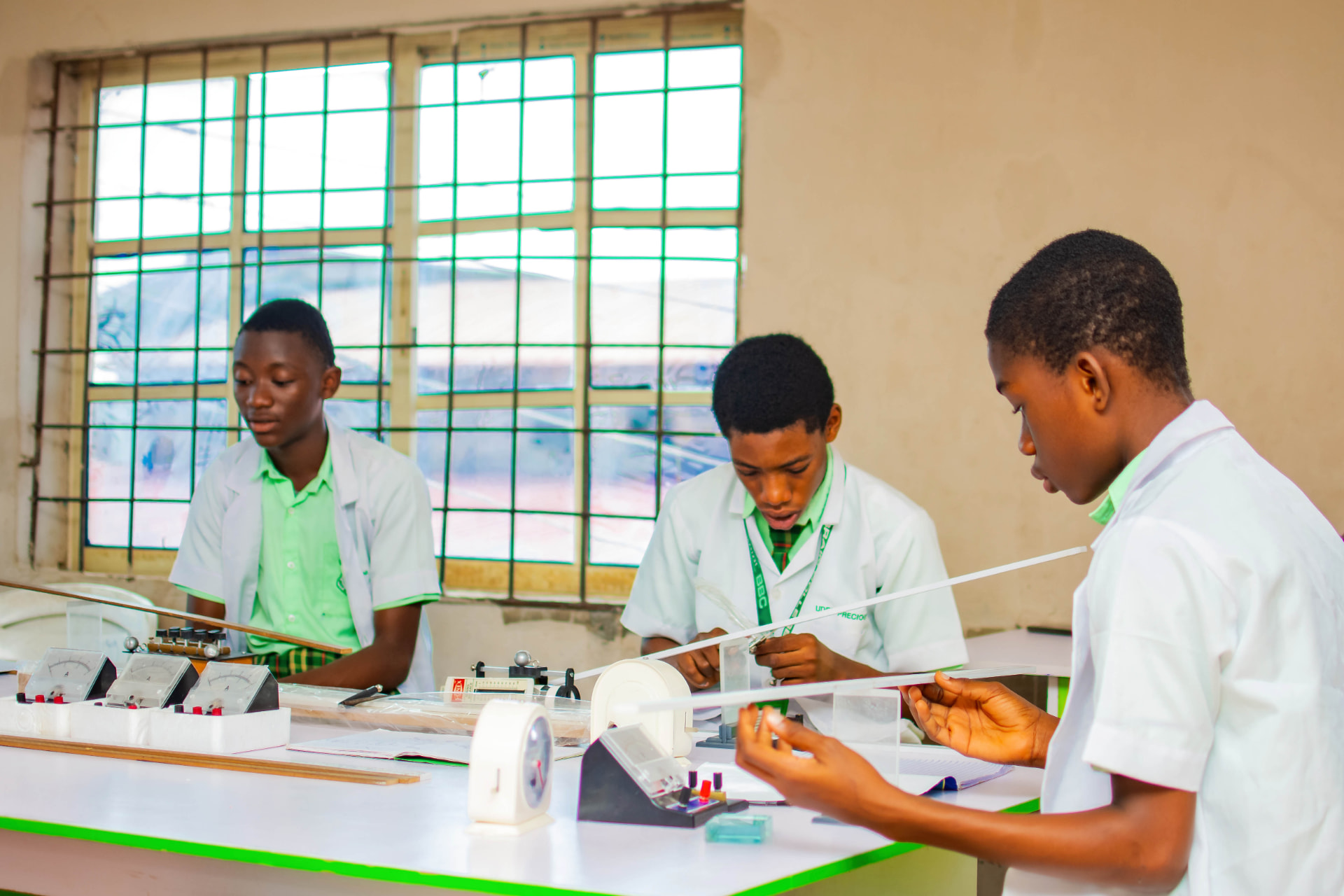 Best Brain College students conducting a physics experiment